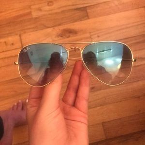 Gold rimmed light blue gradient ray bans